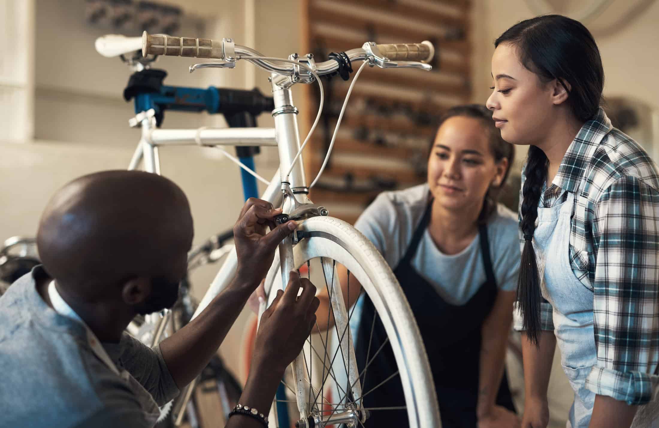 Customer visits bike shop for repairs after finding the business online.